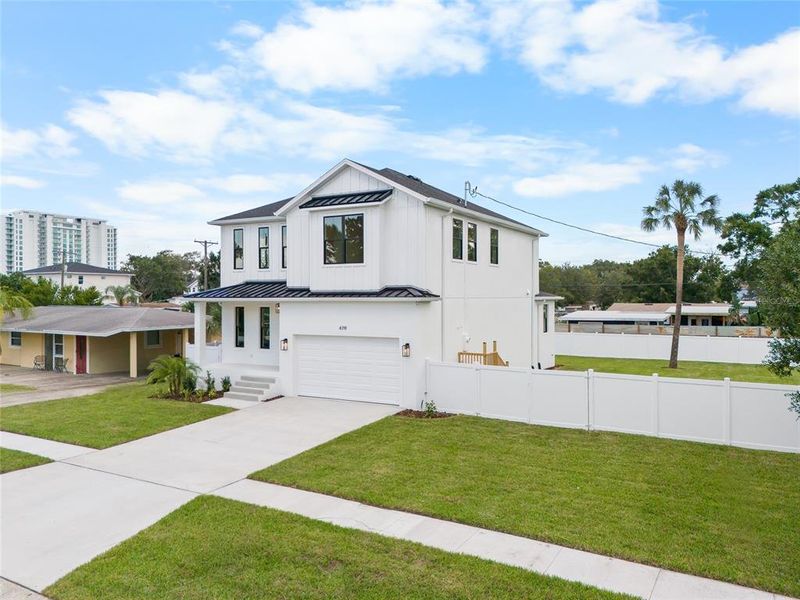 Front exterior of a new home in , Tampa, FL, highlighting curb appeal (Image 25).