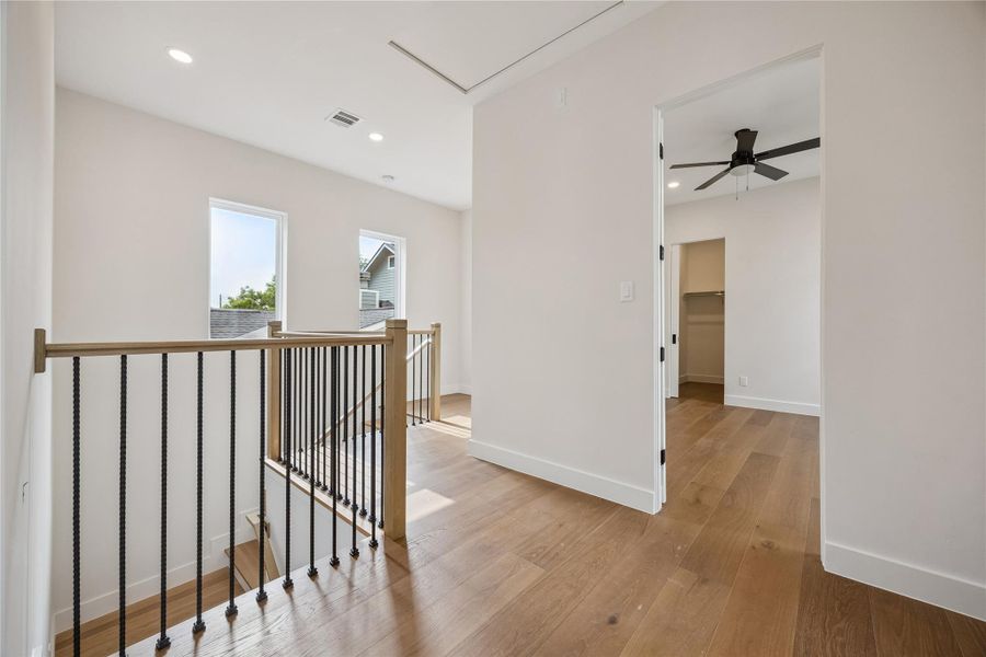 The upstairs landing creates additional separation between the bedrooms while allowing natural light to move throughout the second floor. Wide-plank flooring continue throughout the upper level. The upstairs landing creates additional separation between the bedrooms while allowing natural light to move throughout the second floor. Wide-plank flooring continue throughout the upper level.