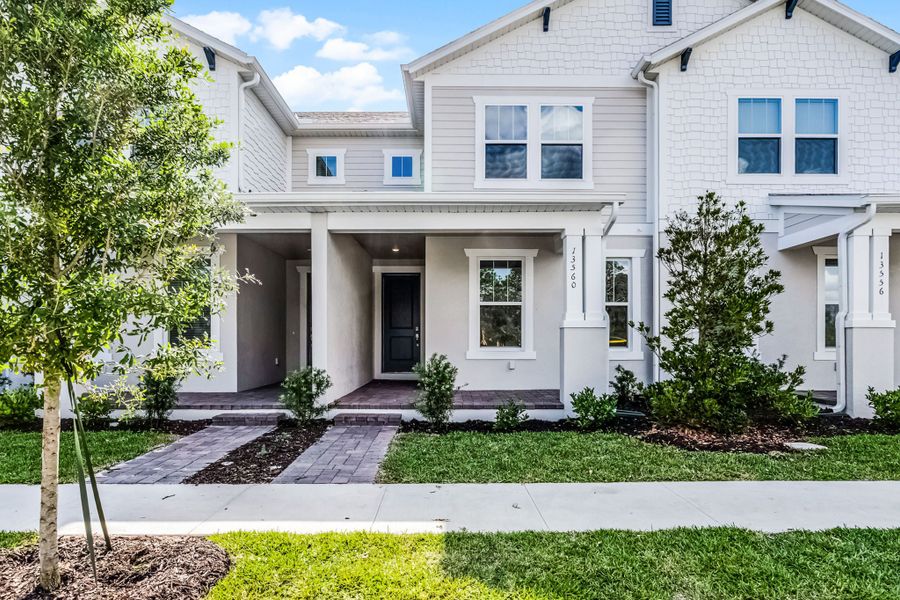 Representative exterior photo of a completed home built from the Newton by Rockwell Homes in Harvest at Ovation - Townhomes, Winter Garden, FL (Image 29). Representative exterior photo of a completed home built from the Newton by Rockwell Homes in Harvest at Ovation - Townhomes, Winter Garden, FL (Image 29).