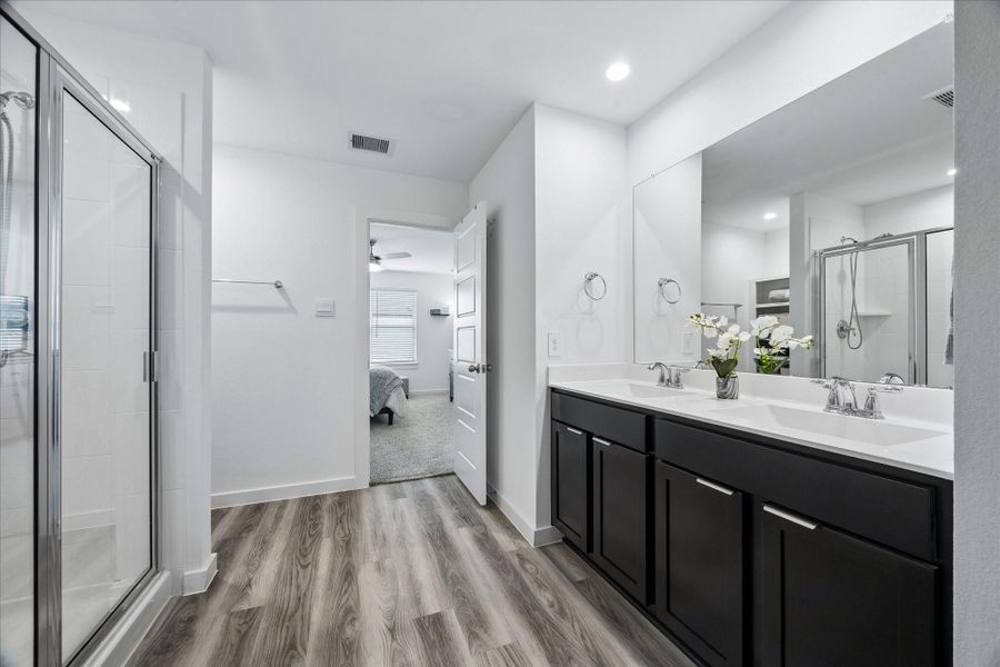 Primary bath is large with a walk-in shower and generous storage. Double sinks. Primary bath is large with a walk-in shower and generous storage. Double sinks.