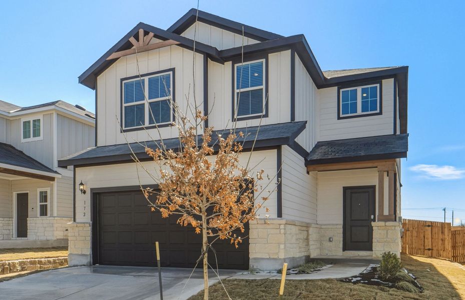 Front exterior of a new home in Sunfield, Buda, TX, highlighting curb appeal (Image 21).