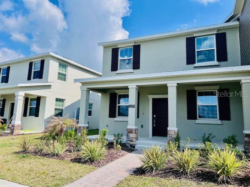 Front exterior of a new home in , Kissimmee, FL, highlighting curb appeal (Image 1). Front exterior of a new home in , Kissimmee, FL, highlighting curb appeal (Image 1).