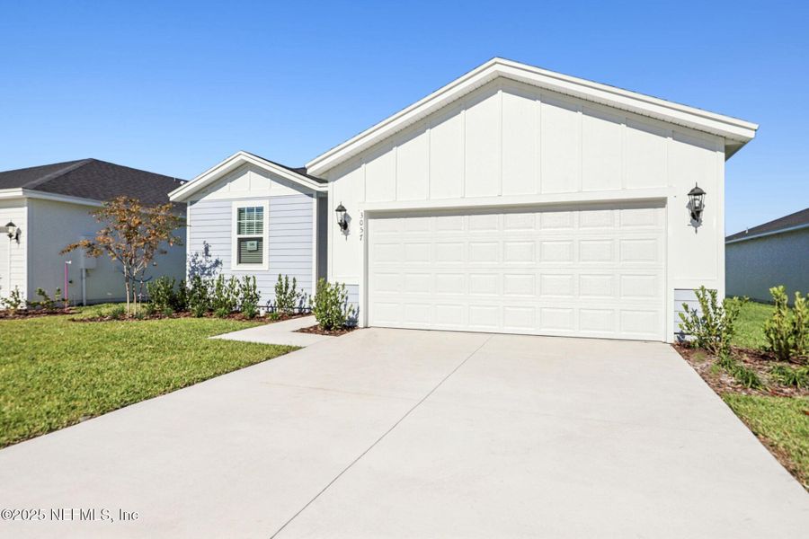 Front exterior of a new home in Lakes at Bella Lago - Signature Series, Green Cove Springs, FL, highlighting curb appeal (Image 2). Front exterior of a new home in Lakes at Bella Lago - Signature Series, Green Cove Springs, FL, highlighting curb appeal (Image 2).