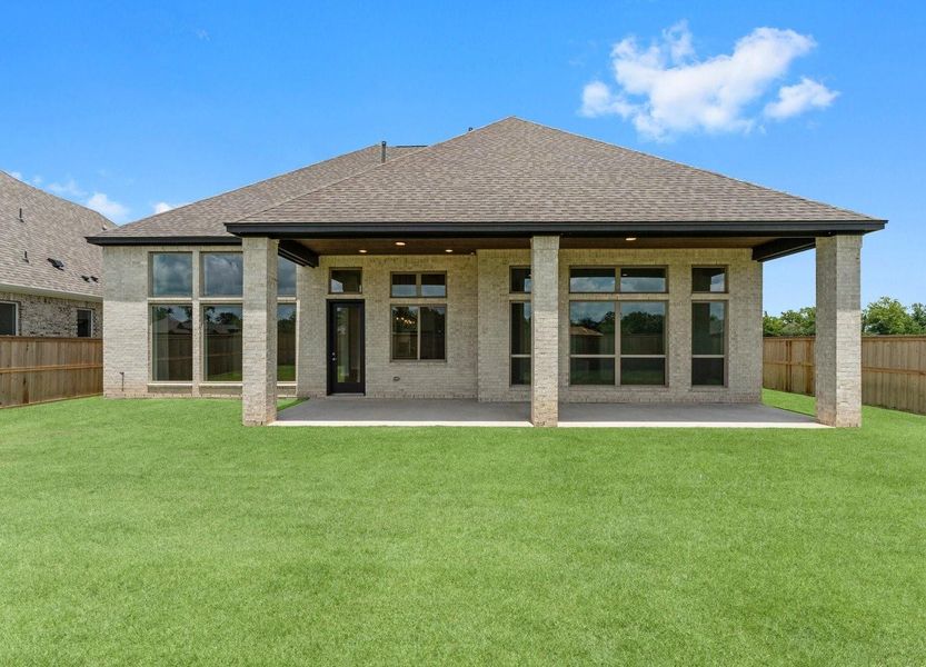 Front exterior of a new home in Fulshear Lakes 70’s, Fulshear, TX, highlighting curb appeal (Image 19). Front exterior of a new home in Fulshear Lakes 70’s, Fulshear, TX, highlighting curb appeal (Image 19).