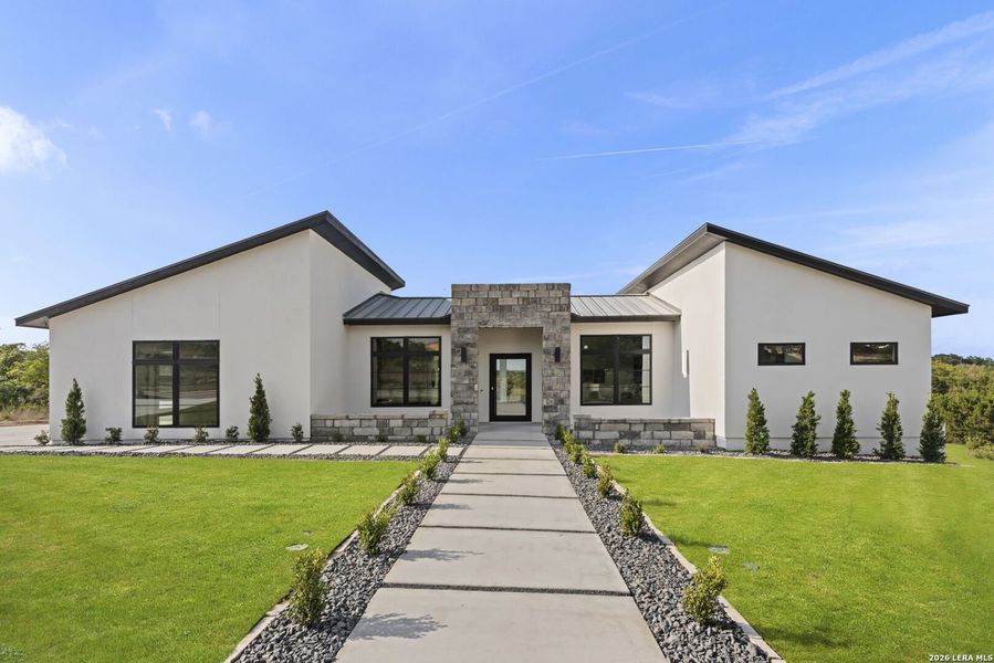 Front exterior of a new home in , San Antonio, TX, highlighting curb appeal (Image 22). Front exterior of a new home in , San Antonio, TX, highlighting curb appeal (Image 22).