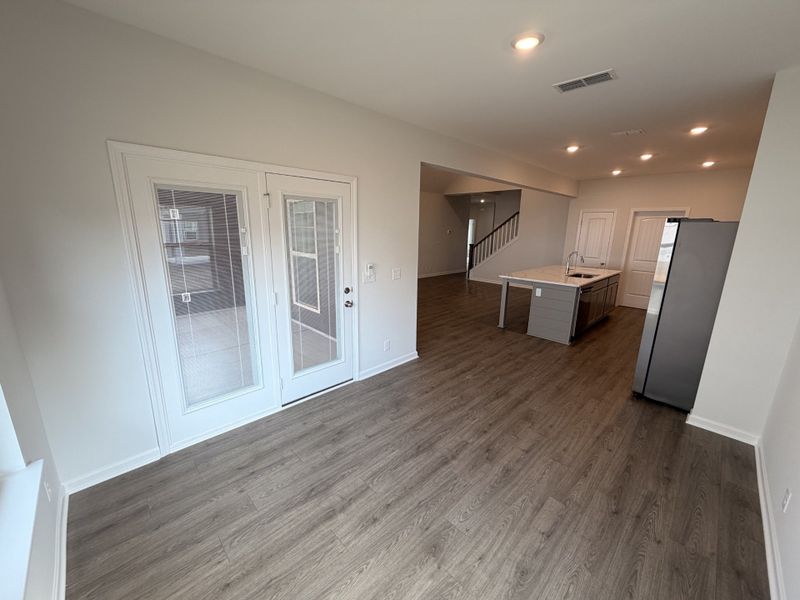 Breakfast nook/dining area leads you out to your oversized covered back porch!