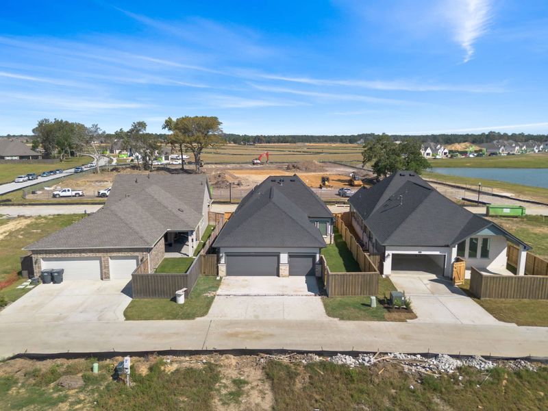 Front exterior of a new home in Riceland, Mont Belvieu, TX, highlighting curb appeal (Image 30). Front exterior of a new home in Riceland, Mont Belvieu, TX, highlighting curb appeal (Image 30).