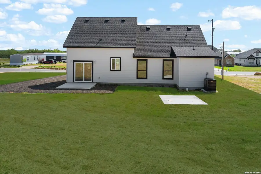 Exterior details and patio area of a home in , Atascosa (Image 4).