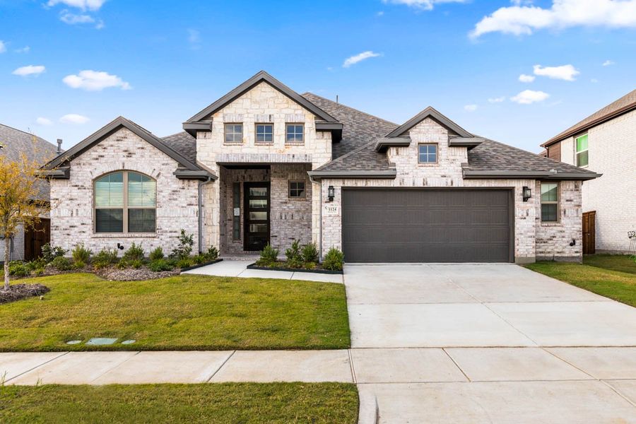 Front exterior of a new home in Las Lomas, Forney, TX, highlighting curb appeal (Image 24).