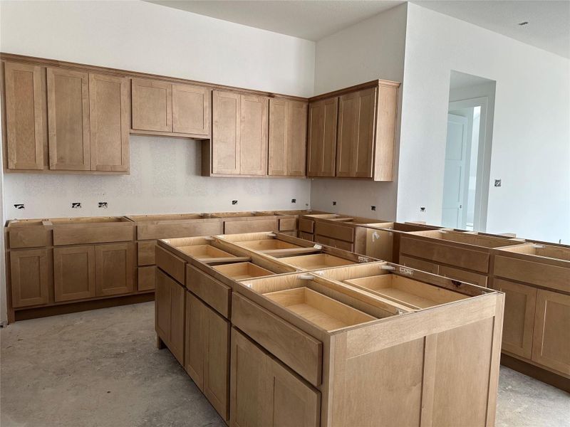 Double sided kitchen island. Plenty of counter space. Double sided kitchen island. Plenty of counter space.