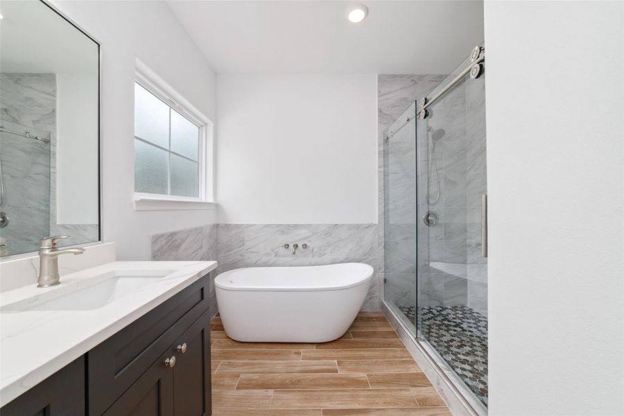 Primary bath features double sinks, soaking tub, oversized custom shower with bench, walk-in closet, and water closet. Primary bath features double sinks, soaking tub, oversized custom shower with bench, walk-in closet, and water closet.