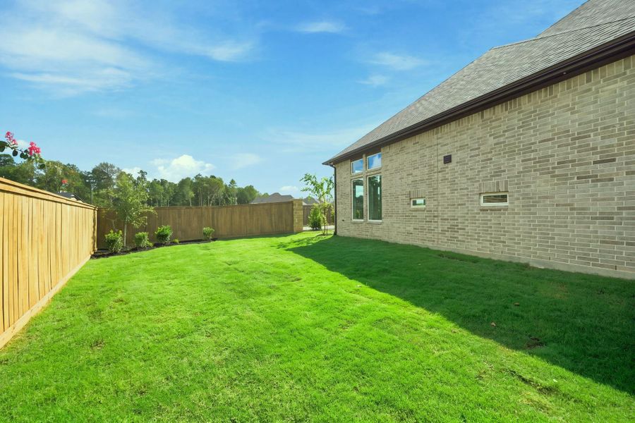 Exterior details and patio area of a home in The Highlands, Porter (Image 30).