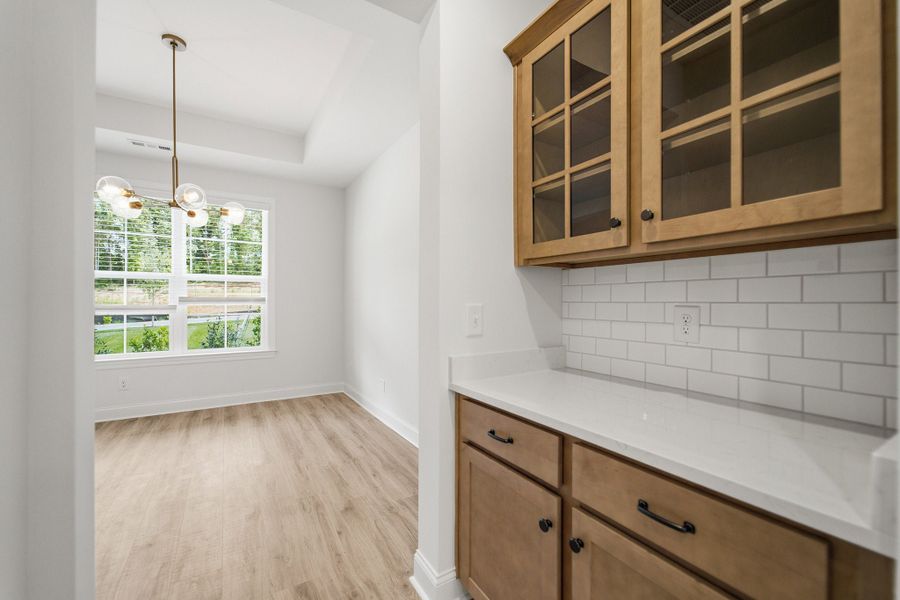 Furnished interior view inside a new home in Aden Woods, Fairview (Image 5).