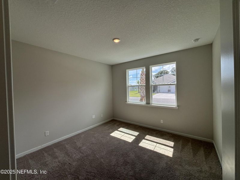 Spacious, unfurnished interior of a new home in The Cypress Series at Reserve East, Flagler Beach (Image 27).