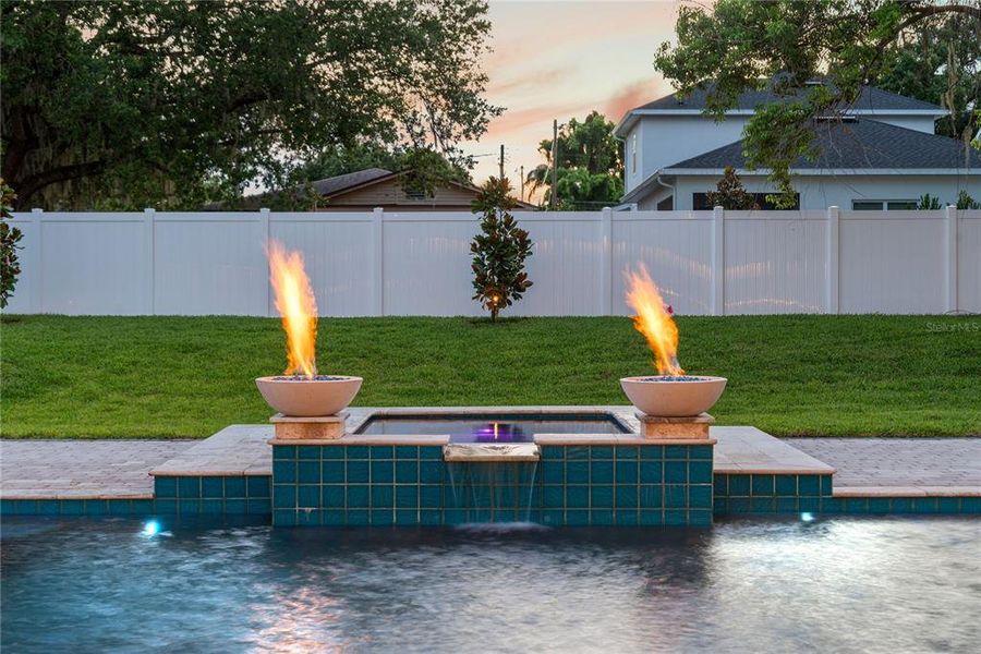 Heated pebbletec saltwater pool with spa, sunshelf with water feature, variable speed high efficiency pump, and 2 gas fireballs Heated pebbletec saltwater pool with spa, sunshelf with water feature, variable speed high efficiency pump, and 2 gas fireballs
