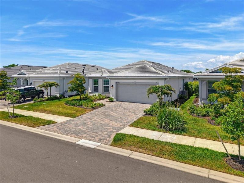 Front exterior of a new home in , Englewood, FL, highlighting curb appeal (Image 29). Front exterior of a new home in , Englewood, FL, highlighting curb appeal (Image 29).