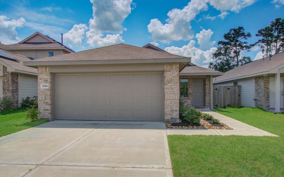 Front exterior of a new home in Tavola: Cottage Collection, New Caney, TX, highlighting curb appeal (Image 22).