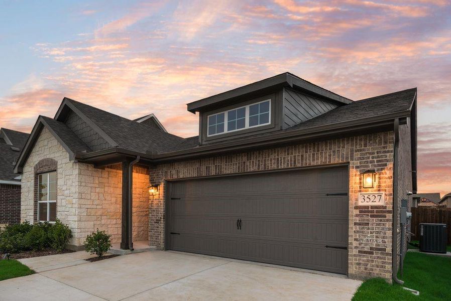 Front exterior of a new home in Liberty Pointe, Gainesville, TX, highlighting curb appeal (Image 1).
