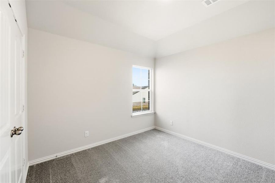 Empty room with baseboards and carpet floors