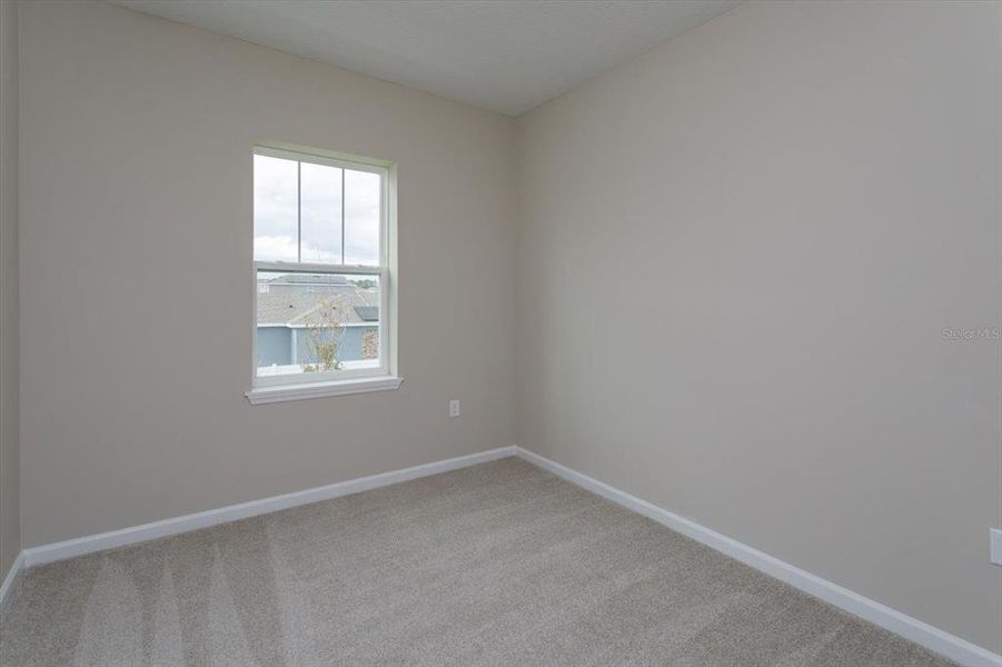 Spacious, unfurnished interior of a new home in Serenade at Ovation, Winter Garden (Image 24).