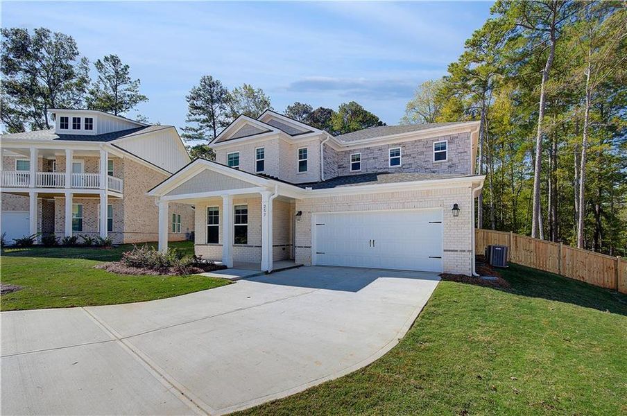 Front exterior of a new home in Burchwood, Stockbridge, GA, highlighting curb appeal (Image 17).