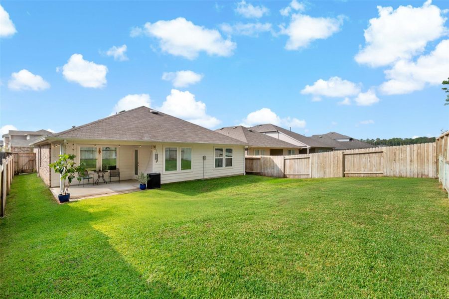 Exterior details and patio area of a home in Harrington Trails at The Canopies, New Caney (Image 21). Exterior details and patio area of a home in Harrington Trails at The Canopies, New Caney (Image 21).