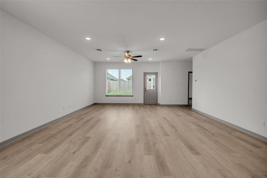 Unfurnished living room with recessed lighting, light wood-style flooring, and ceiling fan