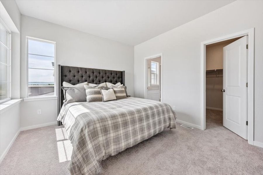 A bed in a room. A bed in a room.