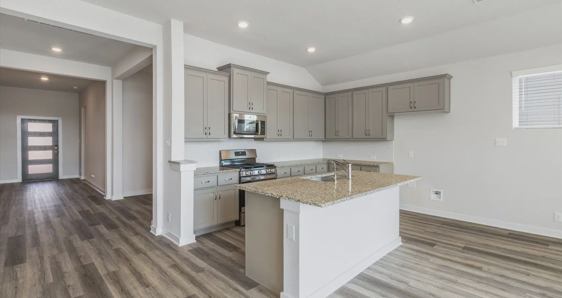 Representative furnished interior of a home built from the Megan by Chesmar Homes in Stream Waters, Buda (Image 3).