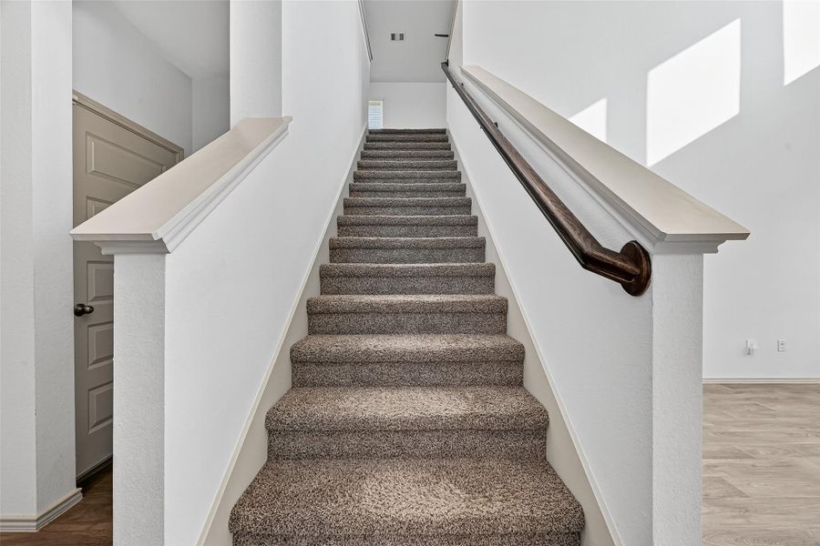 The second floor features a game room/family room and three additional bedrooms.