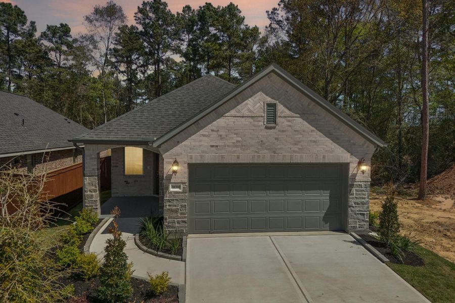 Front exterior of a new home in Woodhavyn 40', Magnolia, TX, highlighting curb appeal (Image 20).