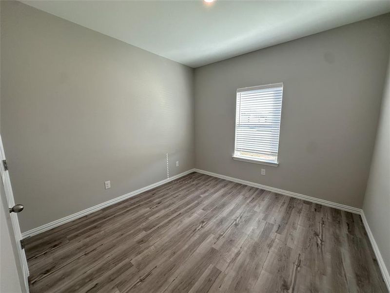 Spare room with hardwood / wood-style flooring