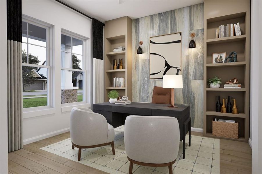 Home office featuring built in shelves and light wood-type flooring
