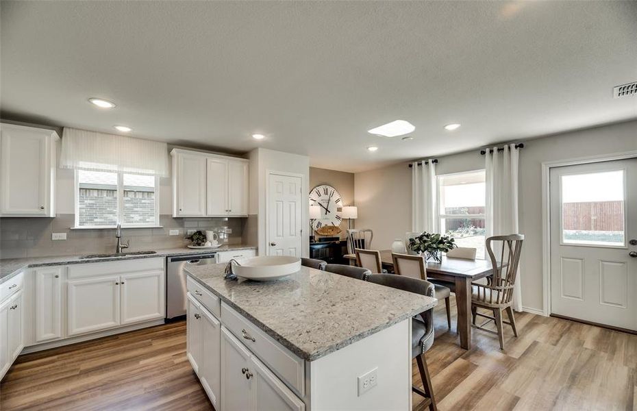 *Model Representation - Dining area off kitchen with large windows