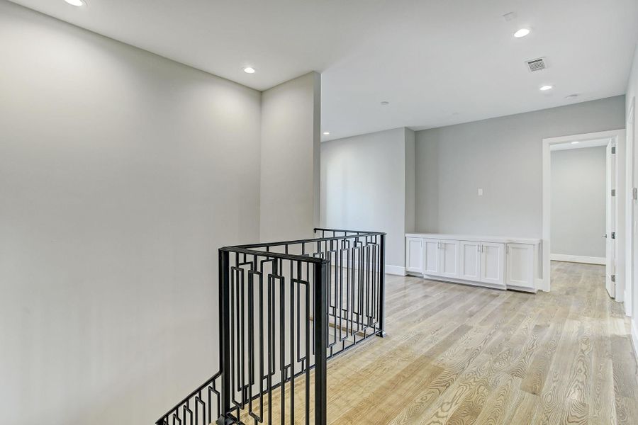 Open and airy plan as you enter the upstairs and look into the gameroom. Open and airy plan as you enter the upstairs and look into the gameroom.