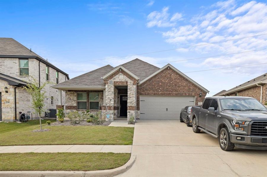 Front exterior of a new home in Stonehaven, Seagoville, TX, highlighting curb appeal (Image 23).