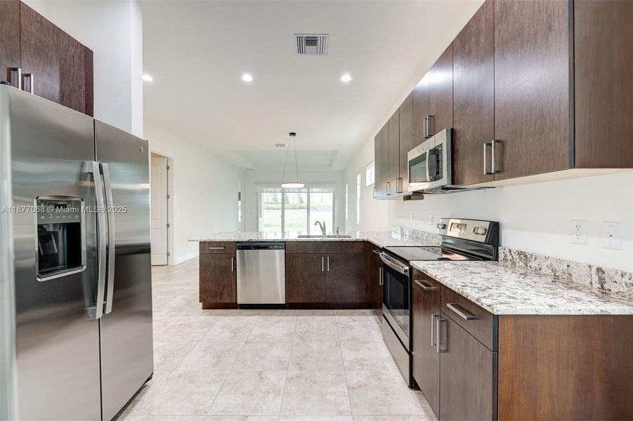 Furnished interior view inside a new home in , Port St. Lucie (Image 10).