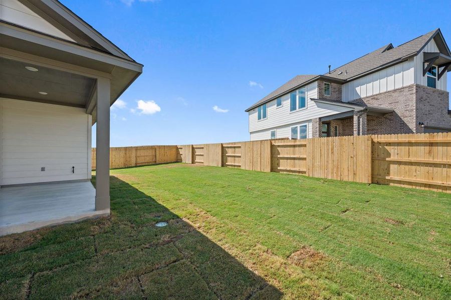 Exterior details and patio area of a home in Terrace Collection At Turner's Crossing, Buda (Image 28).