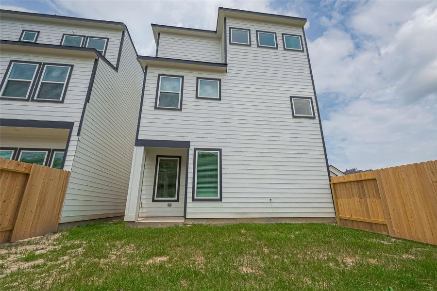 Front exterior of a new home in Regents Court, Houston, TX, highlighting curb appeal (Image 2).