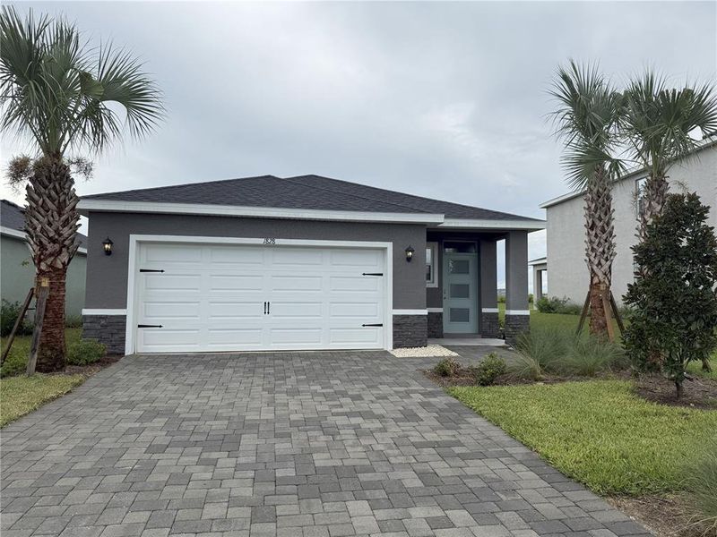 Front exterior of a new home in Legacy Preserve, Parrish, FL, highlighting curb appeal (Image 1). Front exterior of a new home in Legacy Preserve, Parrish, FL, highlighting curb appeal (Image 1).