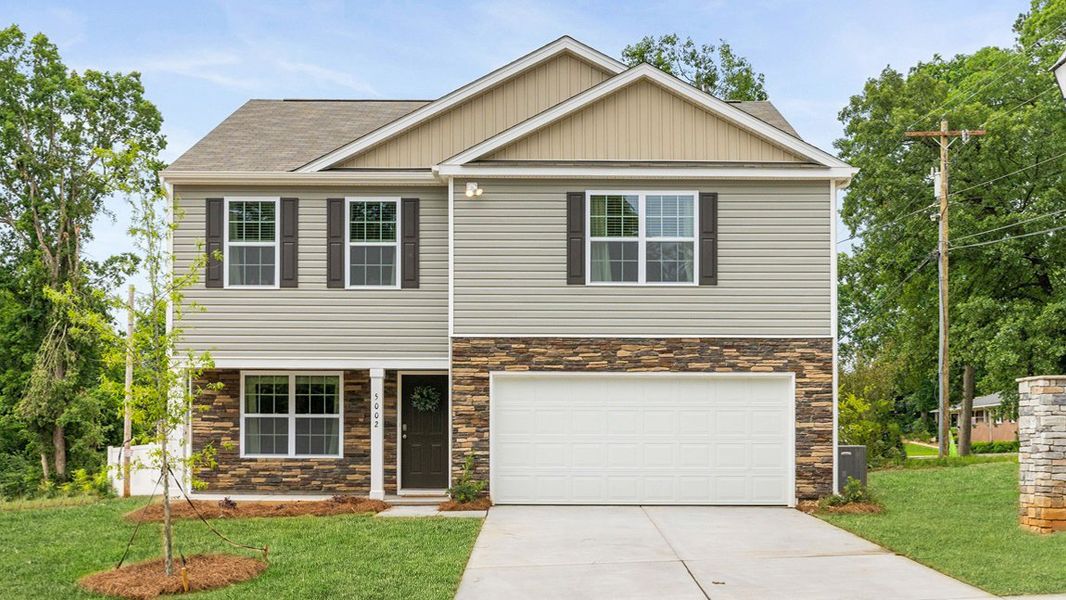 Front exterior of a new home in Wildbrook Village, Waynesville, NC, highlighting curb appeal (Image 1). Front exterior of a new home in Wildbrook Village, Waynesville, NC, highlighting curb appeal (Image 1).