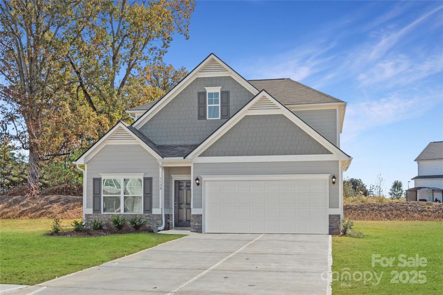 Front exterior of a new home in Green Acres, Concord, NC, highlighting curb appeal (Image 1).