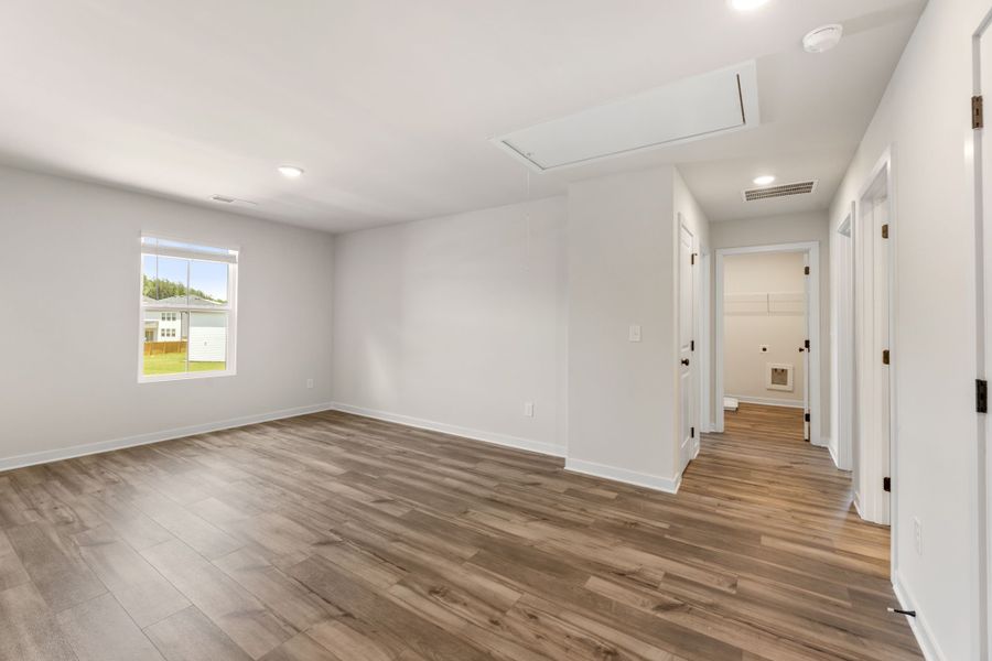 A room with white walls and a wood floor. A room with white walls and a wood floor.