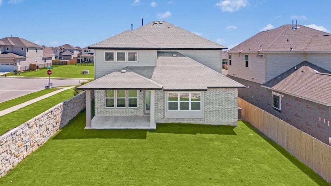 Front exterior of a new home in University Heights, Round Rock, TX, highlighting curb appeal (Image 17).