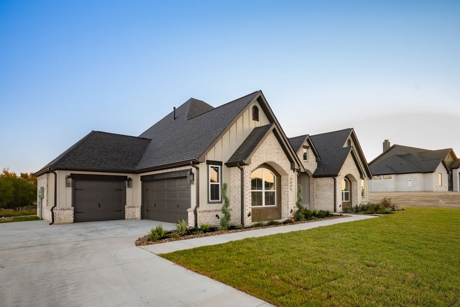 Front exterior of a new home in Windmill Hill, Bryan, TX, highlighting curb appeal (Image 30).