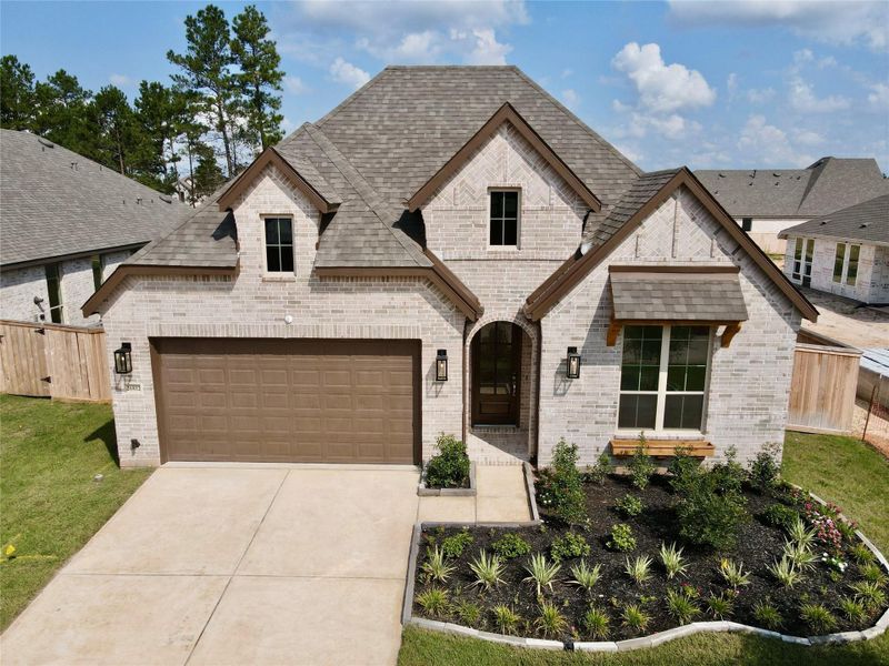 Front exterior of a new home in Kresston: 55ft. lots, Magnolia, TX, highlighting curb appeal (Image 2). Front exterior of a new home in Kresston: 55ft. lots, Magnolia, TX, highlighting curb appeal (Image 2).