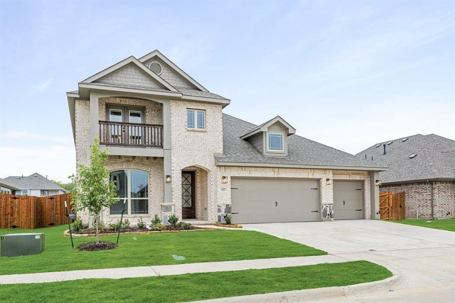 Front exterior of a new home in Hampton Park, Glenn Heights, TX, highlighting curb appeal (Image 2).