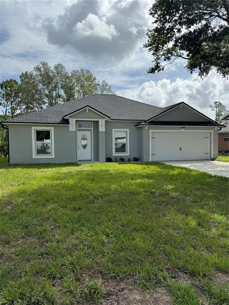 Front exterior of a new home in , Deltona, FL, highlighting curb appeal (Image 21).