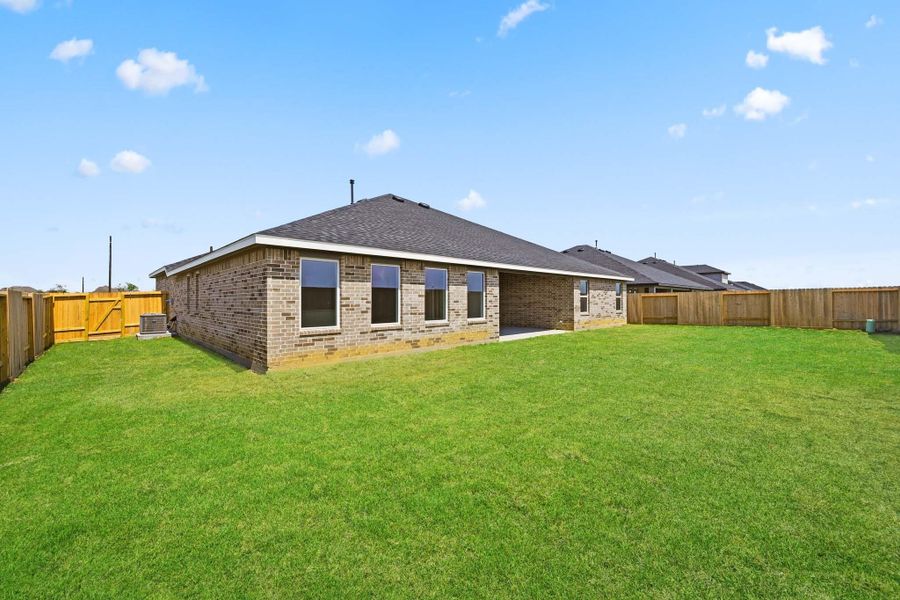 Exterior details and patio area of a home in Riverside Estates, Mont Belvieu (Image 3).