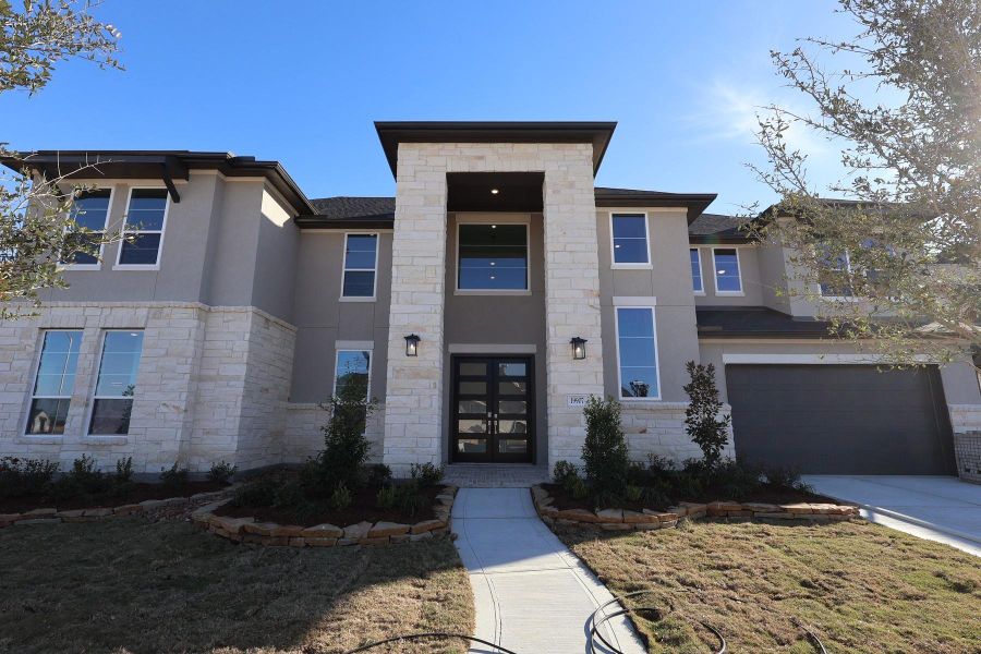 Front exterior of a new home in Dunham Pointe, Cypress, TX, highlighting curb appeal (Image 20).